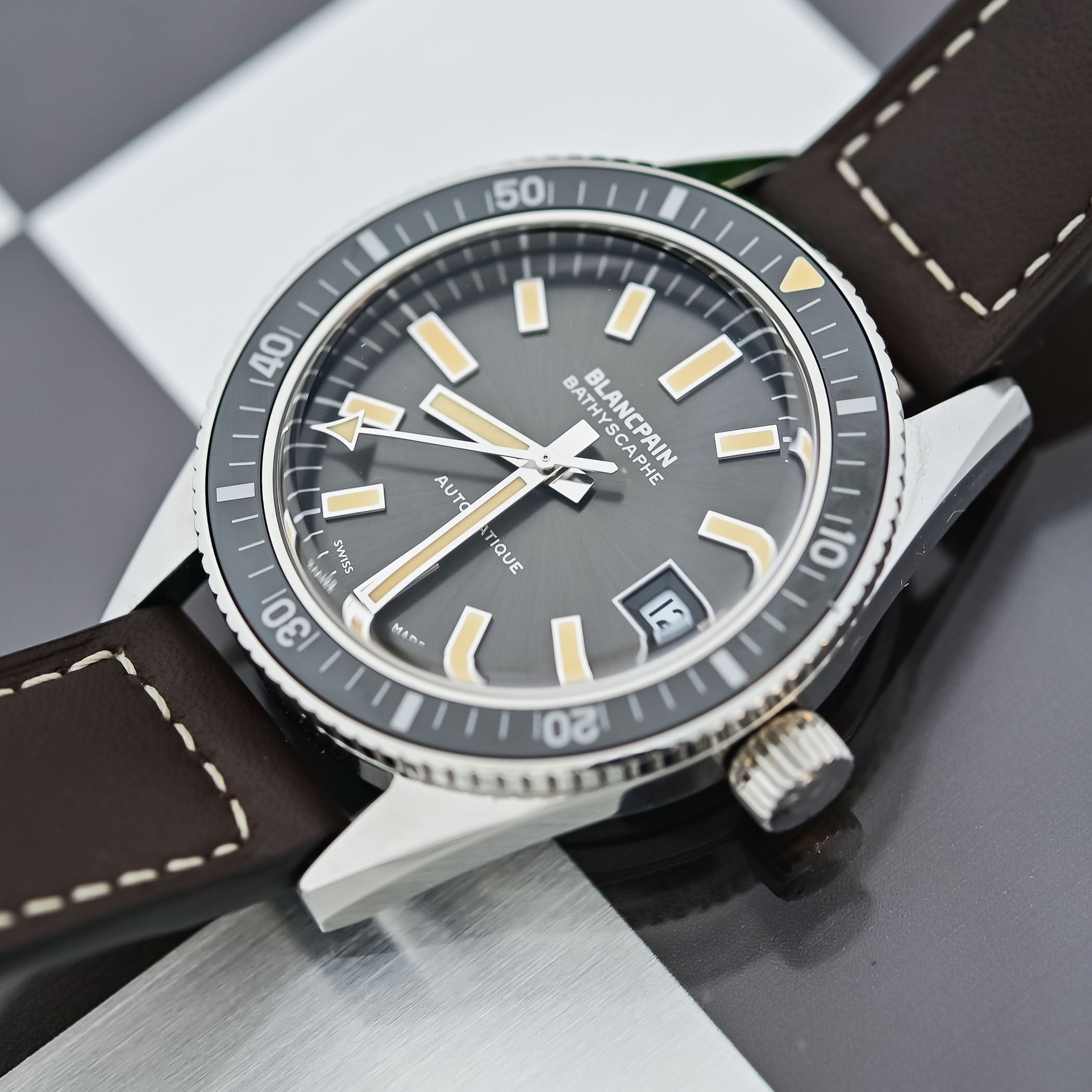 Blancpain Bathyscaphe 70th anniversary dial close-up showing applied indices, arrow seconds hand, and framed date window at 3