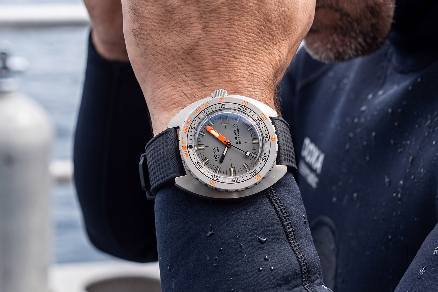 Angled view of the Doxa SUB 300 Ti5 Clive Cussler showing the titanium case profile, no-deco bezel and sandwich dial